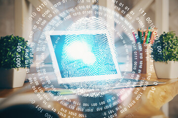 Computer on desktop in office with finger print drawing. Double exposure. Concept of business data...