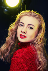 smiling blonde in red sweater