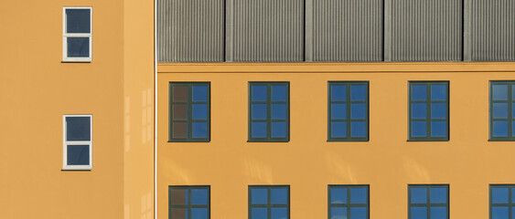 Fototapeta premium Windows in an Ochre Wall. Minimal Aesthetics.