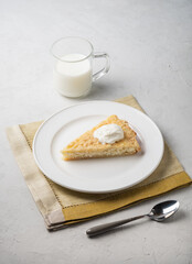 Healthy breakfast made from soft cottage cheese casserole , served with sour cream and  milk.
