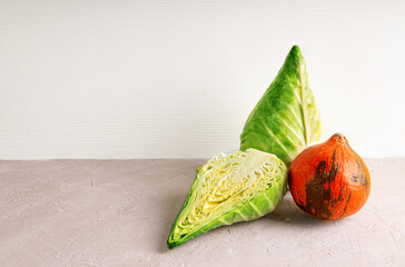 Fresh ripe pointed cabbage and orange pumpkin assortment. Copy space.