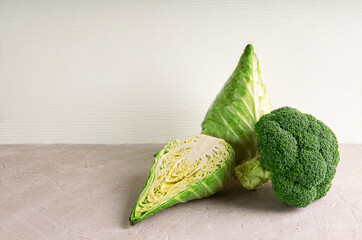 Fresh ripe pointed cabbage and broccoli in a saucepan assortment. Copy space.