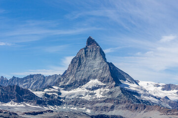 Matterhorn Mountain with white snow and blue sky in summer in Switzerland