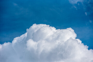 Naklejka na ściany i meble Bright blue sky with fluffy clouds in Carpathian mountains