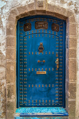 Old door in the old town.Traditional ancient blue Moroccan door, in the Medina of Essaouria, Morocco.North Africa