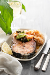 fried salmon with shrimps on white dish