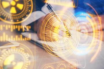 Fototapeta premium Technology theme hologram over woman's hands taking notes background. Concept of Tech. Double exposure