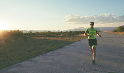triathlon athlete running on morning trainig
