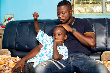 the young father admires his cute son