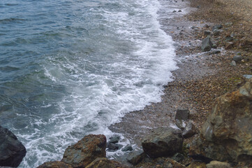 waves of japanese sea at rocky beach