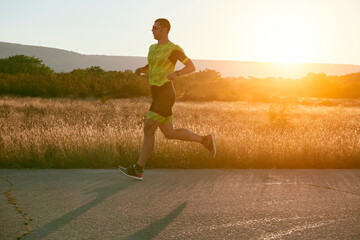 triathlon athlete running on morning trainig