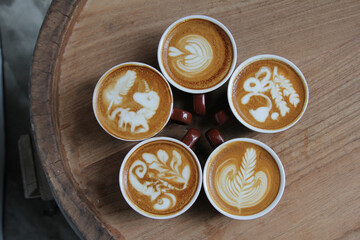 five cups of coffee on vintage wood. Top view , cup on wooden table. View from top