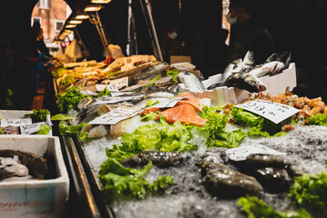 Fish market in Venice (Venezia), Italy; close up of stand with tuna and shrimps