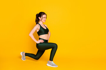 Obraz na płótnie Canvas Full length body size view of nice sportive girl trainer doing sit-ups healthy life isolated over bright yellow color background