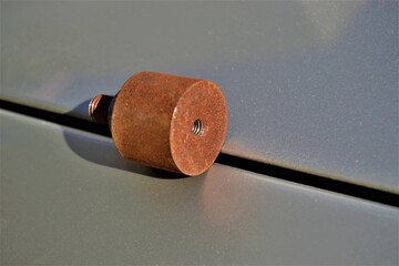 Rusted steel mile and hexagonal nut. Rusted metal exposed to corrosion with thread screw and...