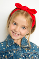 child on a white background , beautiful smile, big eyes, white teeth, red headband