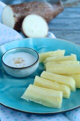 Thai dessert, Cassava root with coconut milk sauce and sesame seeds.

