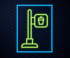 Glowing neon line Cafe and restaurant location icon isolated on brick wall background. Fork and spoon eatery sign inside pinpoint. Vector..