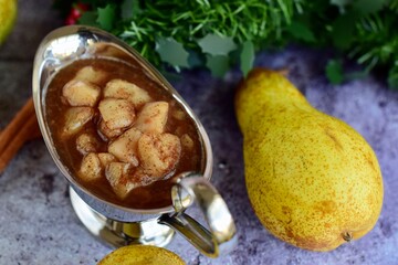 Pear compote with cinnamon. Served for dessert at Christmas celebration. Selective focus
