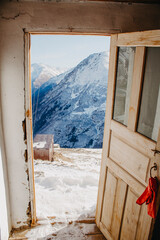 Open door with mountain views. View from the window to nature.
