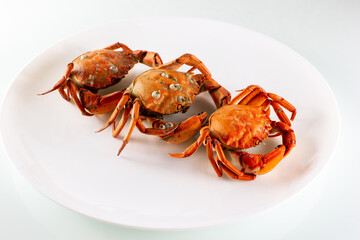 three crabs on a plate