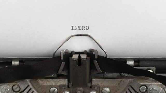 to type text intro on a vintage and old typewriter close-up
