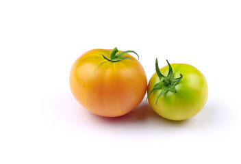Yellow and green tomatoes isolated on a white background. Healthy food. Vegan food. Organic tomatoes
