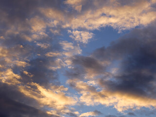 Dramatic sky with clouds at sunset. Cloudscape with sunlight.