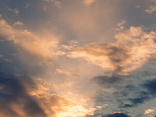 Dramatic sky with clouds at sunset. Skyscape with ray beams.