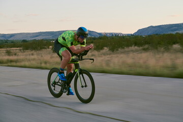 Fototapeta premium triathlon athlete riding a bike