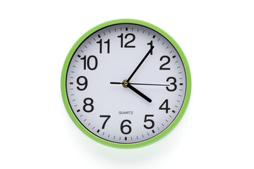 Clock on a white background. Time six minutes past five. Clipping path included.