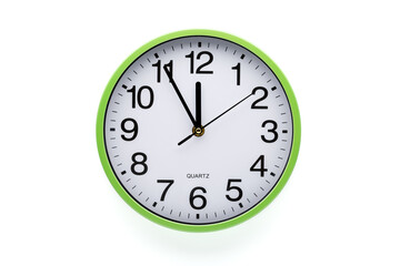 Wall clock on white background. Clipping path included. Five minutes to twelve.