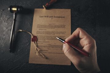 Notary's public pen and stamp on testament and last will. Notary public tools.