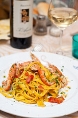 Noodles (tagliatelle) with shrimp, courgette flower and pesto sauce, Al  Porto restaurant, Cagliari, Sardinia, Italy, Europe