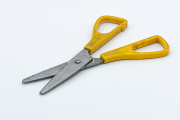 old typical yellow scissors. on white background