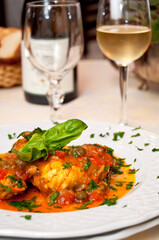 Monkfish fillets with tomatoes sauce and basil