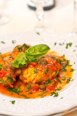 Monkfish fillets with tomatoes sauce and basil