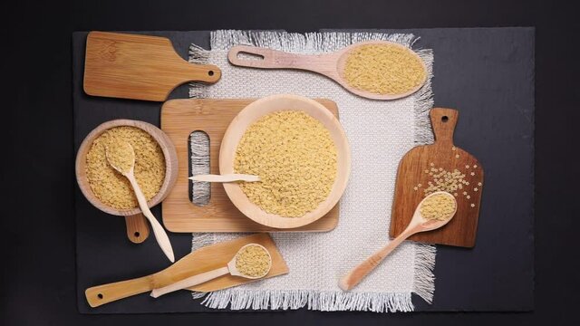 food background durum wheat semolina pasta stelle on a black background, top view