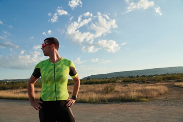 triathlon athlete resting and setting smartwatch