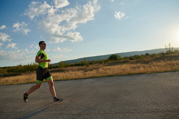 triathlon athlete running on morning trainig