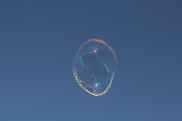 Soap bubble on a blue background.