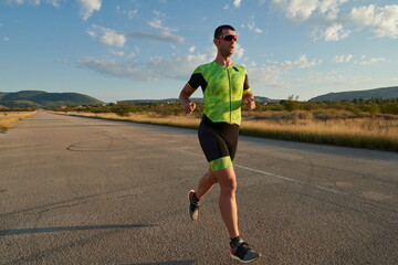 triathlon athlete running on morning trainig