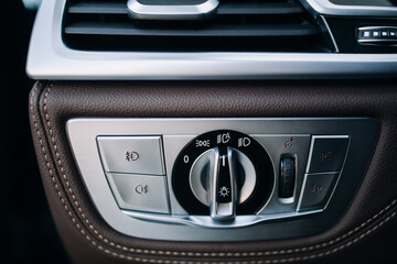 Headlights control panel in the car