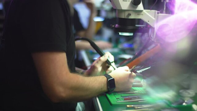 Putting paste on electronic component on circuit board