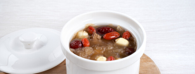 Close up of sweet snow white fungus soup with lotus seed, Chinese red dates and wolfberry.