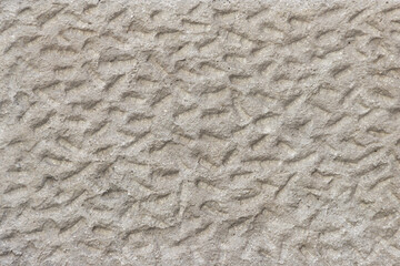 Rough uneven surface of the plastered wall.