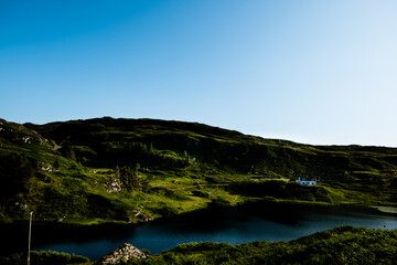 Tarbet, Scotland with cottage on the hills