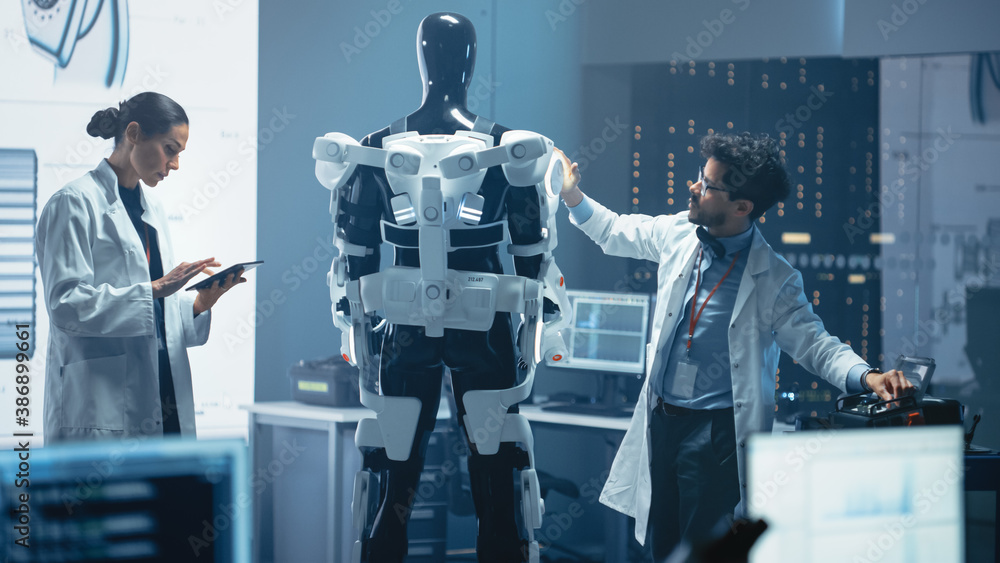 Aufkleber in robotics development laboratory: chief female engineer and top male scientist work on a bionics e