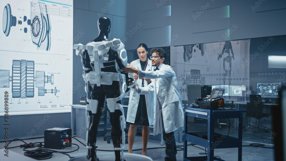 Leinwandbilder in robotics development: international team of engineers and scientists work on robotics exoskeleton