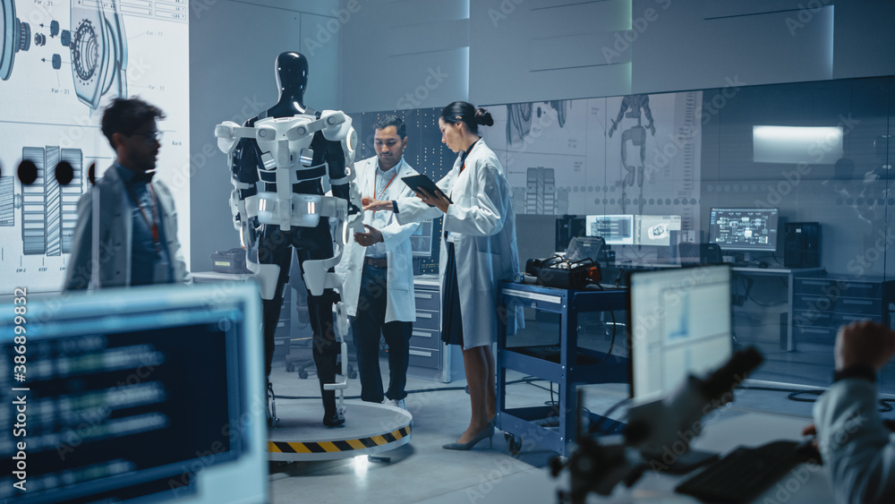 Poster In Robotics Development Laboratory: Chief Female Engineer and Top Male Scientist Work on a Bionics Exoskeleton Prototype. Designing Powered Exosuit to Help Disabled People, Hard Labor Workers